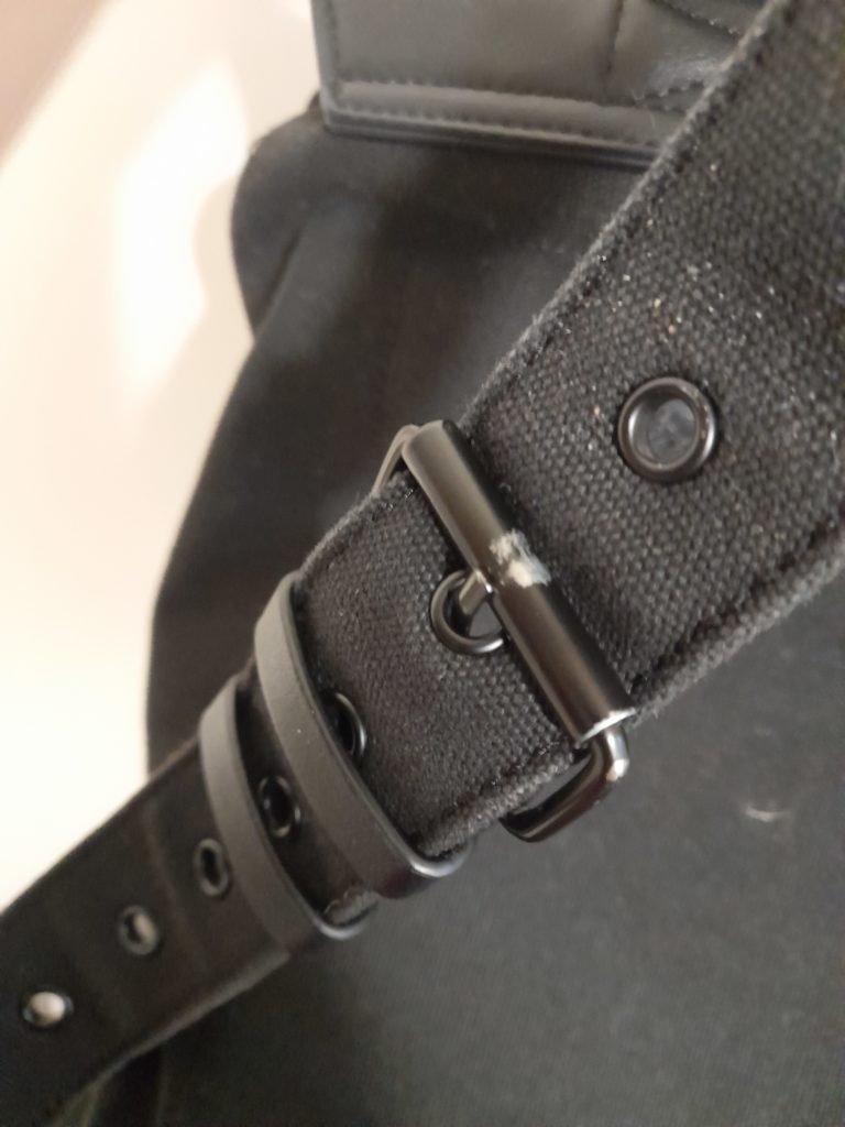 Scratches on metal buckle on a strap of the Praper backpack after two years of use